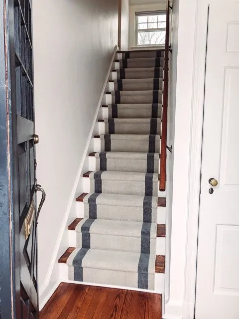 Carpeted stairs with grey striped accents in Madison